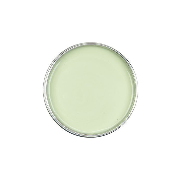 Top view of an uncovered can of GiGi Tea Tree Creme Wax showing melted light pastel green wax inside
