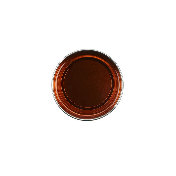 Top view of an open can of GiGi Facial Honee Soft Wax showcasing its deep brown translucent colored wax contents Top view of an open can of GiGi Facial Honee Soft Wax showcasing its deep brown translucent colored wax contents