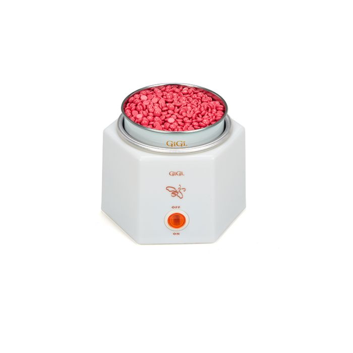 Angled front view of GiGi Space Saver Warmer with a can filled with unmelted pink wax beads placed into its wax well receptacle