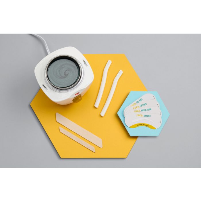 Mini Honee Wax Warmer, 2 Brow Razors, 4 Brow Stencils, 1 Small Accu Edge Applicator, 1 Large Accu Edge Applicator displaced outside packaging 
